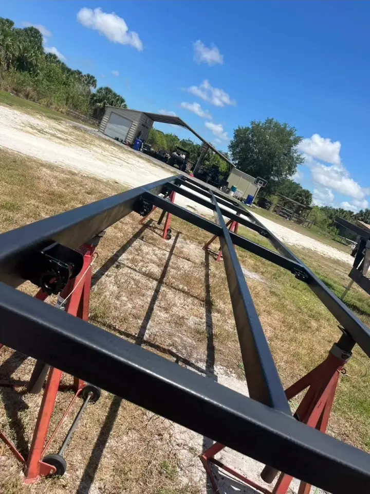 Trailer frame freshly painted black after sandblasting, Vero Beach area