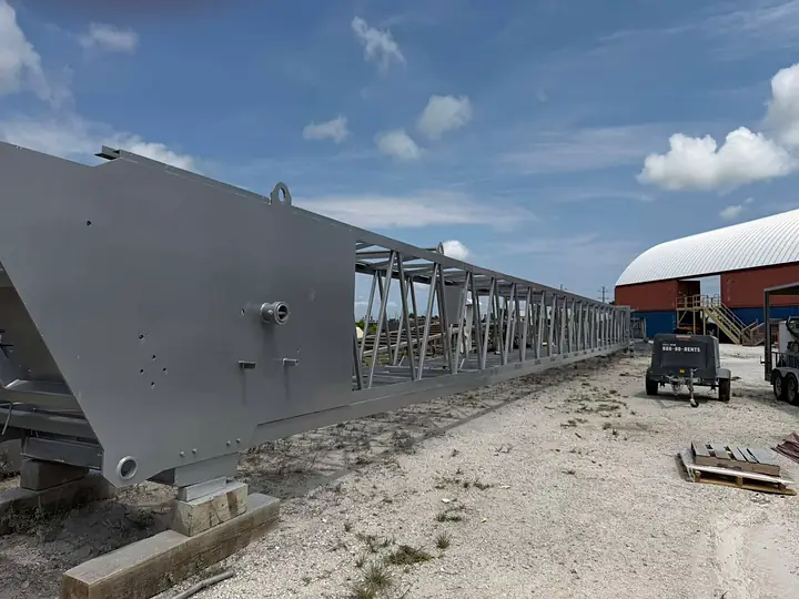 Long sand mine conveyor sandblasted and coated gray by our crew in Florida