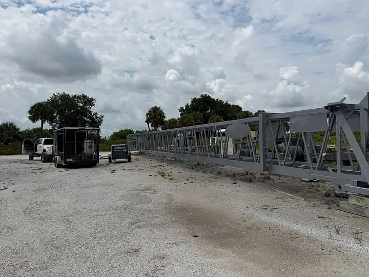 Sand mine conveyor truss sandblasted and coated gray on site