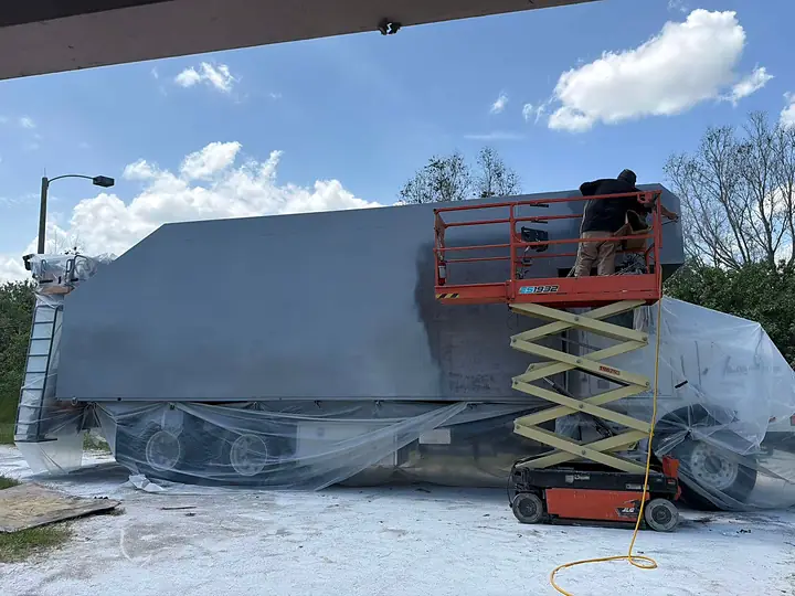 Truck body painted from a scissor lift, Treasure Coast Mobile Sandblasting, Vero Beach FL
