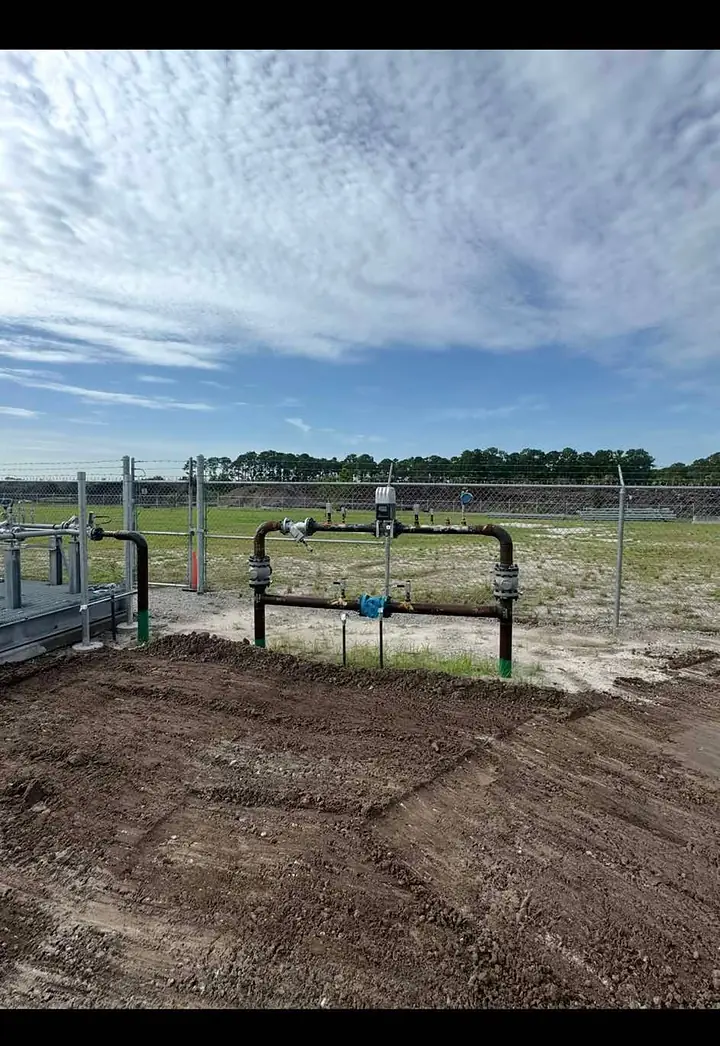 Above-ground line piping at a fenced plant site