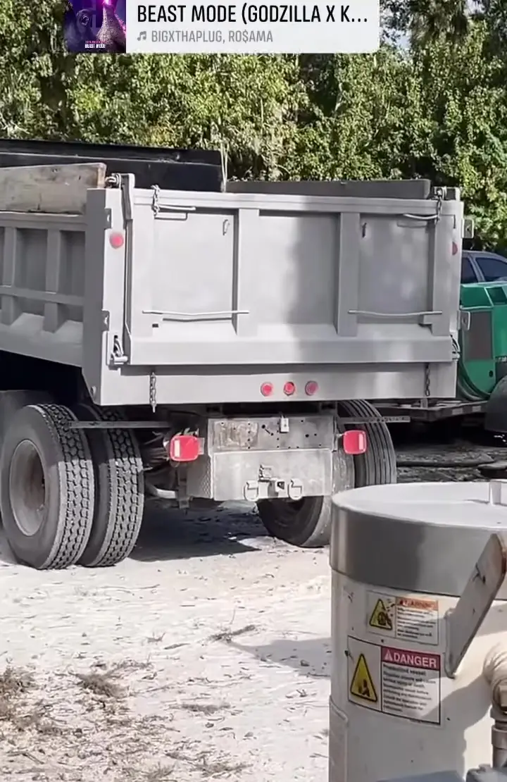 Dump truck body sandblasted and primed gray on site on the Treasure Coast